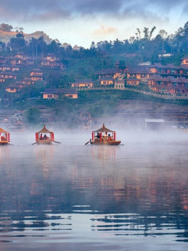 Tourists take a boat at Ban Rak Thai village in Mae Hong Son pro